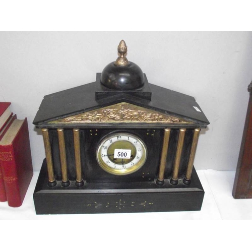 500 - A black slate mantel clock with 6 brass columns