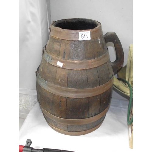 511 - A large copper and wood barrel / jug