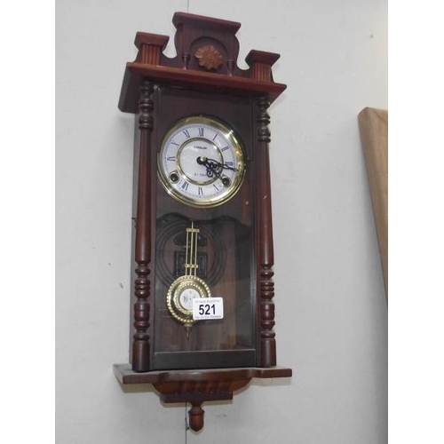 521 - A small modern 31 day wall clock