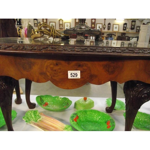 529 - A dark wood nest of 3 tables with glass tops.