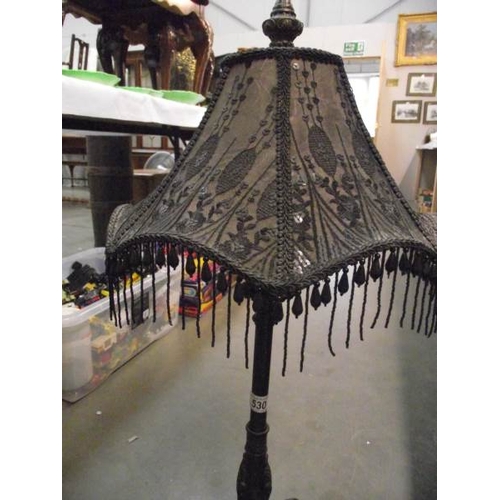 530 - A classical design resin table lamp with black beaded shade.