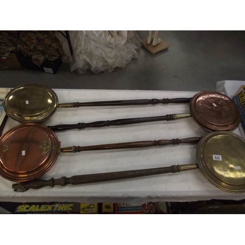 533 - 4 Victorian copper and brass bed warming pans.