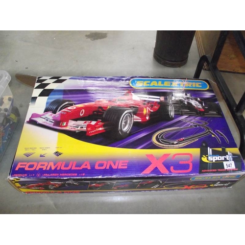 547 - A Scalextric Formula 1 X 3 racing set.