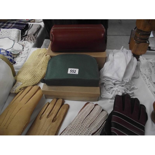 552 - A quantity of gloves, vintage set etc.,