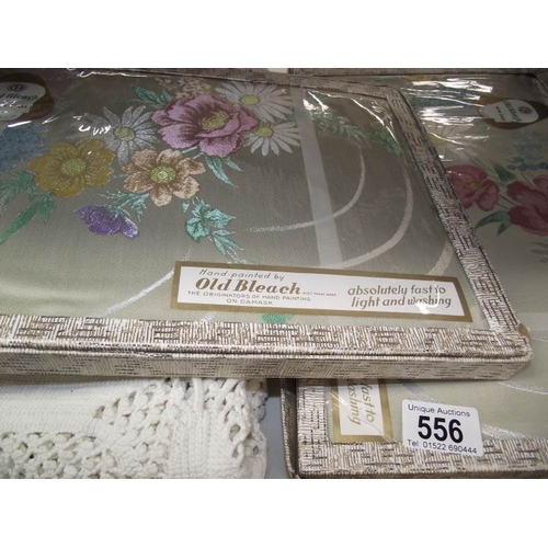 556 - An Irish rose design crochet bedcover with two old bleached hand painted Damask table cloths, made i... 