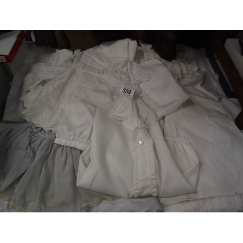 559 - 4 early 20th century Christening dresses with lace embroidery plus dolls clothes etc.,