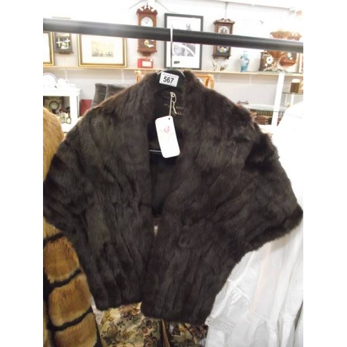 567 - A stylist fur cape by The Fur Room, Rackhams, ideal for wedding cape. (in very good condition).