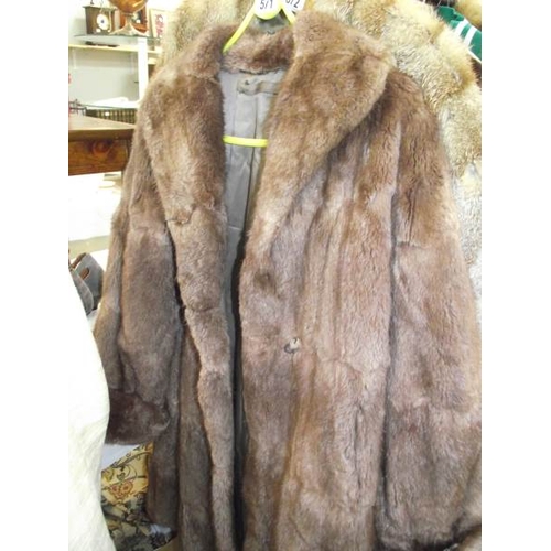 571 - A fur coat.  (repairs to lining, otherwise good).