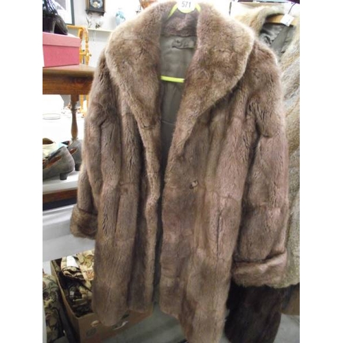 571 - A fur coat.  (repairs to lining, otherwise good).