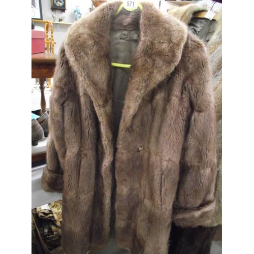 571 - A fur coat.  (repairs to lining, otherwise good).