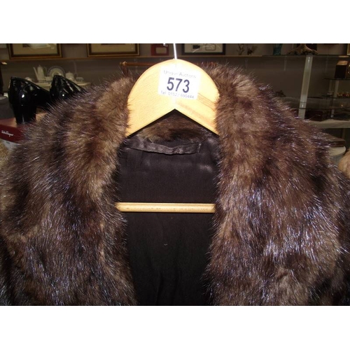 573 - A fur coat.  (In good condition)