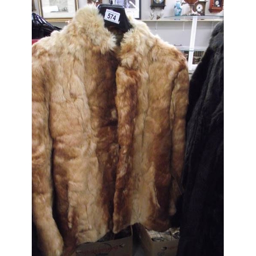 574 - A fur jacket.  (in good condition).