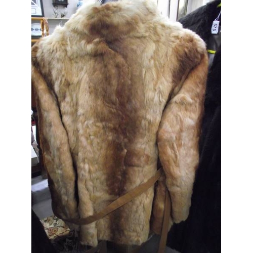 574 - A fur jacket.  (in good condition).