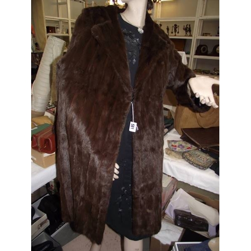 581 - A fine quality full length coat made by M Michaels Furs, Bristol, vintage. (in good condition).