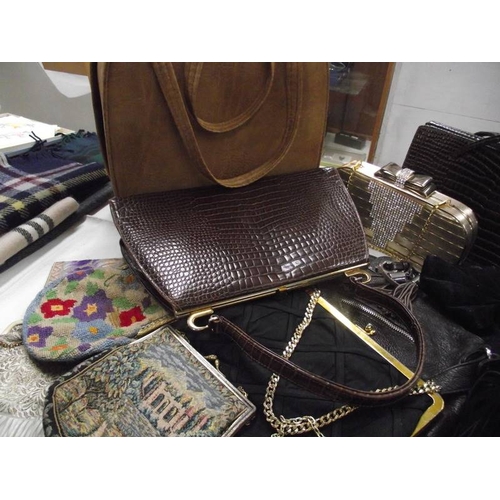 582 - A quantity of vintage handbags.