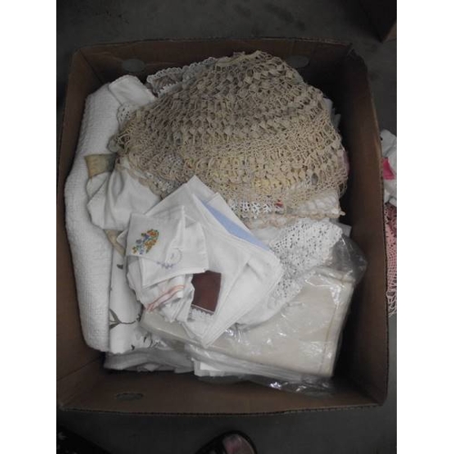 590A - A box of mixed linen/fabric including crocheted doilies etc.,