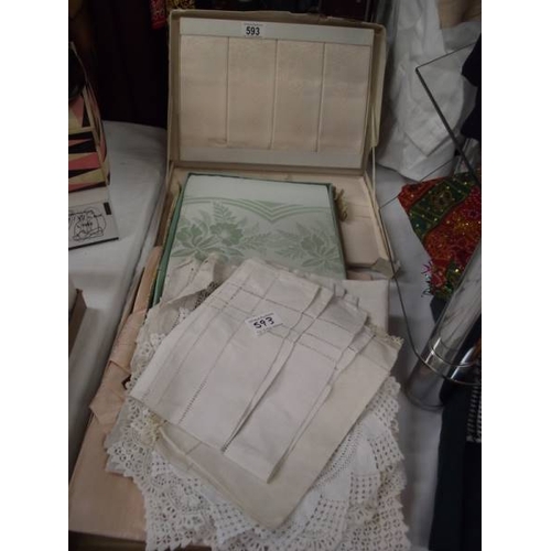 593 - A quantity of vintage and Edwardian linen tablecloths, tray cloths etc.,