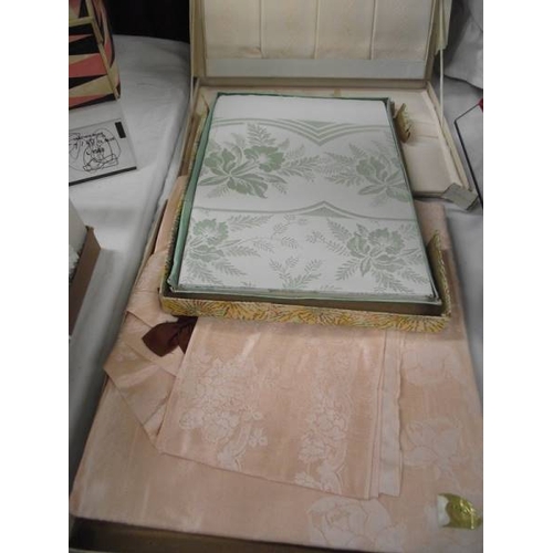 593 - A quantity of vintage and Edwardian linen tablecloths, tray cloths etc.,