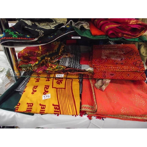 594 - A quantity of Indian Sari's etc.,