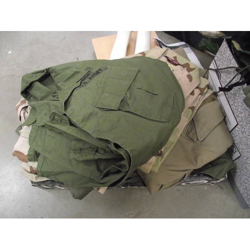 595 - A quantity of military clothing, BB airgun magazines etc.,