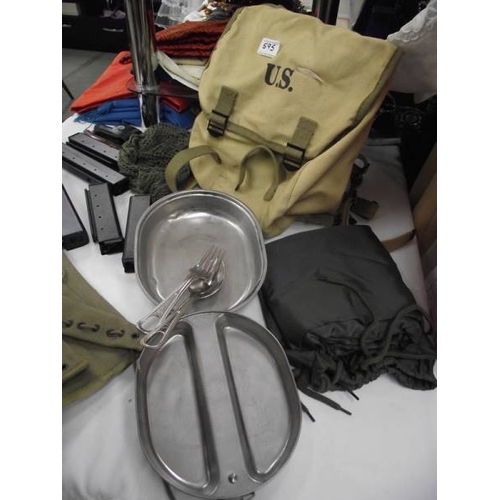 595 - A quantity of military clothing, BB airgun magazines etc.,