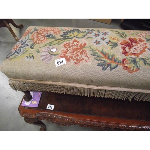 614 - A tapestry covered long foot stool on Queen Anne legs.