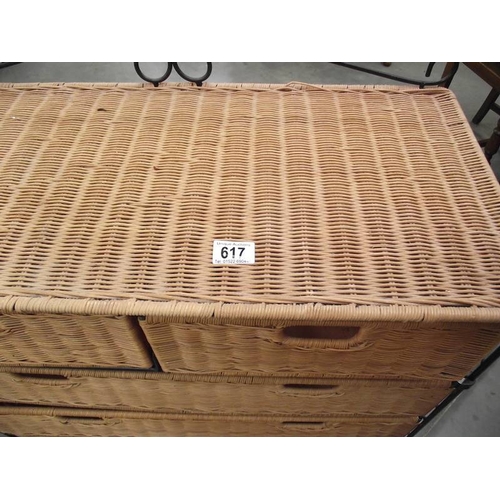 617 - A wicker and wrought iron bathroom chest of drawers.