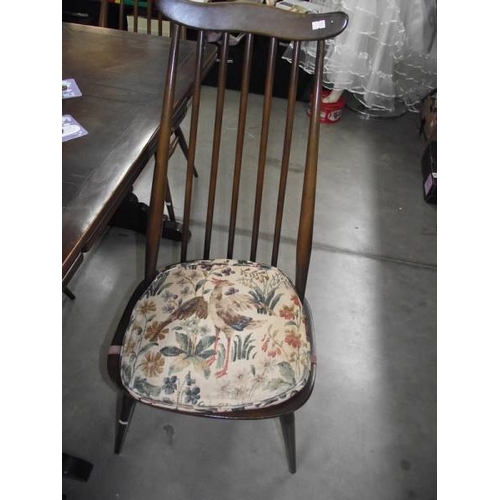 619 - A dark oak draw leaf table and 4 Ercol chairs.