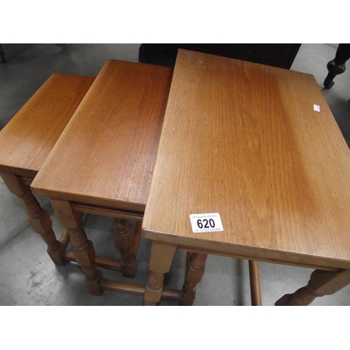 620 - A nest of 3 teak tables.