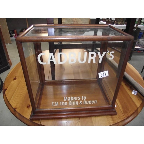 621 - A table top display cabinet with Cadbury advertising.