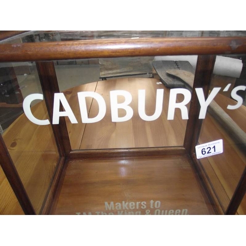 621 - A table top display cabinet with Cadbury advertising.