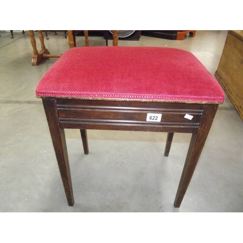 622 - An Edwardian mahogany piano stool with contents.