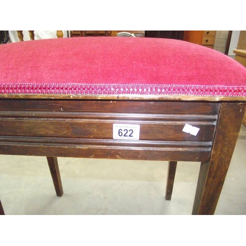 622 - An Edwardian mahogany piano stool with contents.