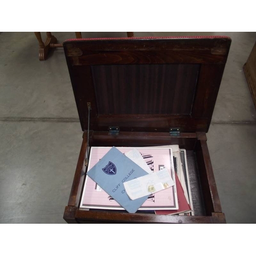 622 - An Edwardian mahogany piano stool with contents.