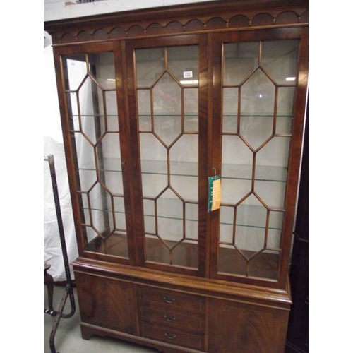 632 - A good inlaid astragal glazed display cabinet with drawers and cupboards by Maples.