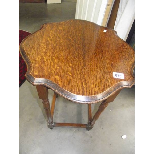 636 - An Edwardian oak side table.