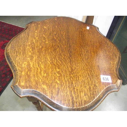 636 - An Edwardian oak side table.