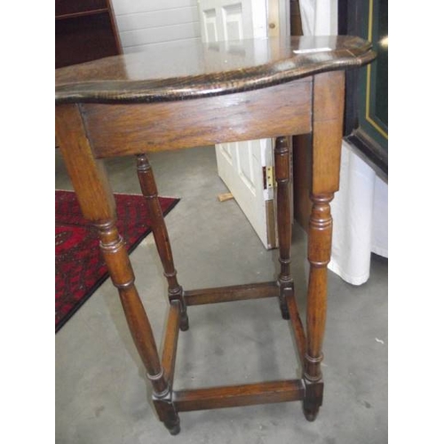 636 - An Edwardian oak side table.