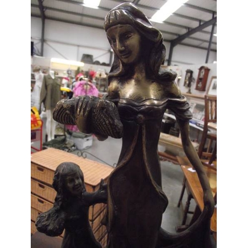 638 - An art nouveau style bronze mother and child, 18'' tall.