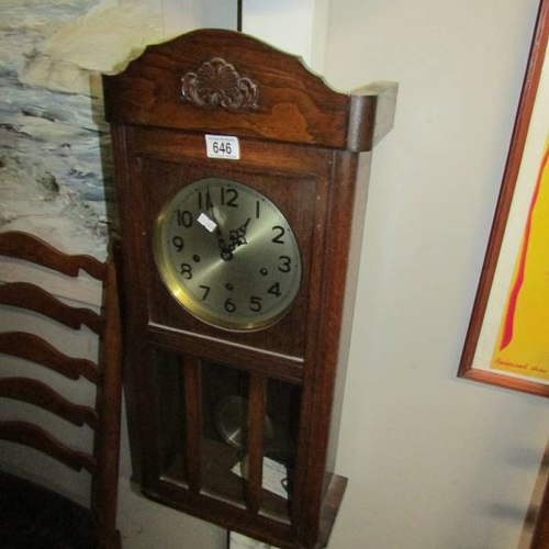 646 - An Edwardian wall clock, in working order.