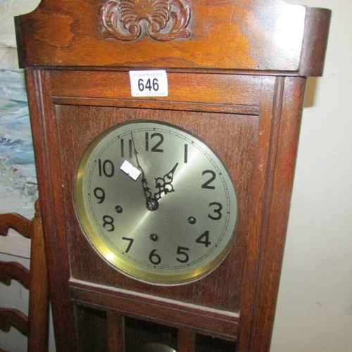 646 - An Edwardian wall clock, in working order.