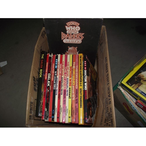 302 - 4 boxes of Doctor Who books. jigsaws, magazines etc.,