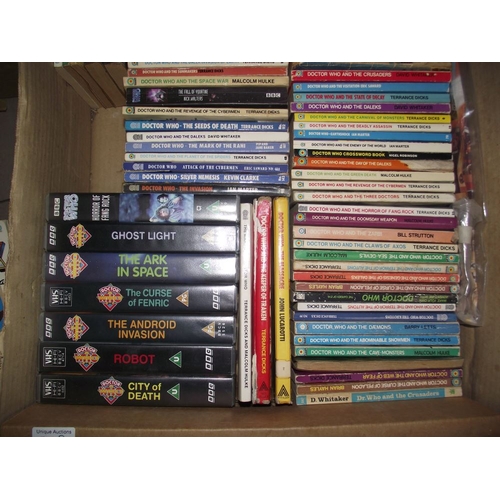 302 - 4 boxes of Doctor Who books. jigsaws, magazines etc.,