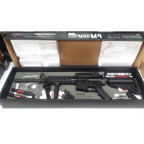 497 - A boxed Airsoft SOPMODM4 gun by Tokyo Marui Co Ltd. Please note magazine clip is missing and would n... 