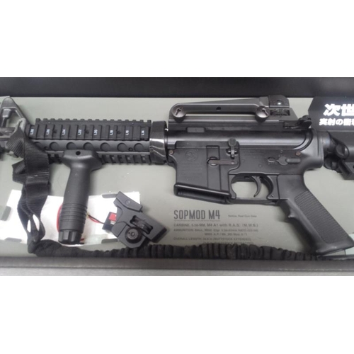 497 - A boxed Airsoft SOPMODM4 gun by Tokyo Marui Co Ltd. Please note magazine clip is missing and would n... 