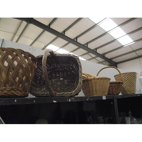 301 - A quantity of wicker baskets etc.