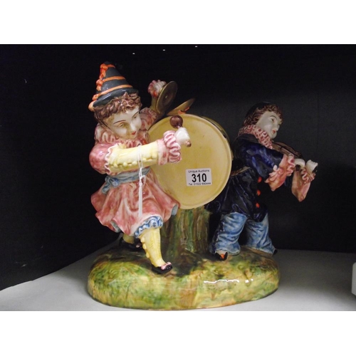 310 - A large continental pottery clown group ornament