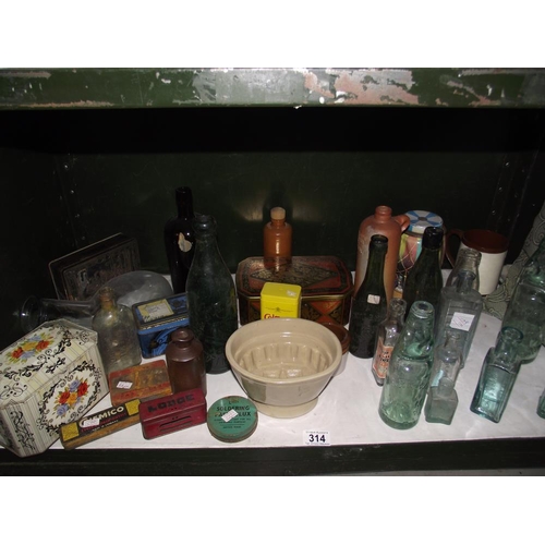 314 - A Lovatts stoneware jelly mould and quantity of old bottles and tins etc.