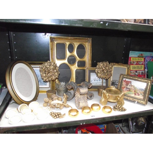 329 - A selection of gilded gold painted picture frames, napkin rings etc.