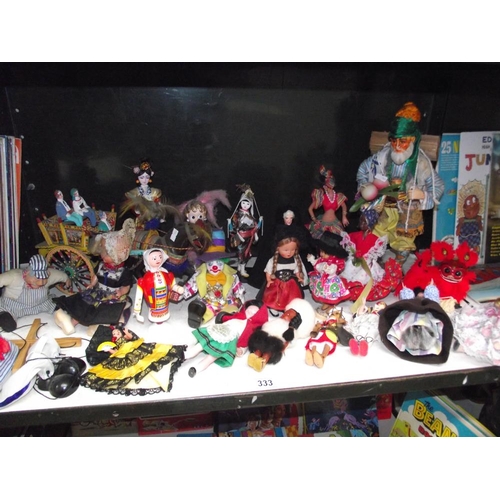 333 - A good selection of vintage dolls in National dress etc.